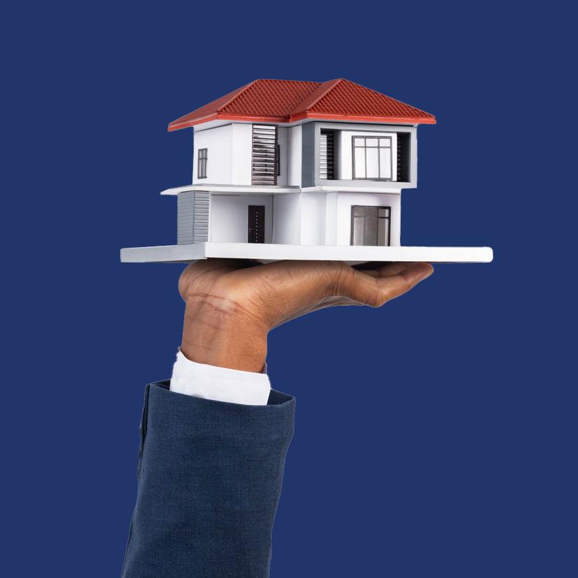Hand holding house